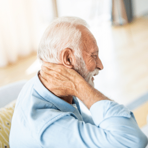 Man with neck pain. Neck pain symptoms and treatment options at Vitality Physical Medicine in Davenport, IA